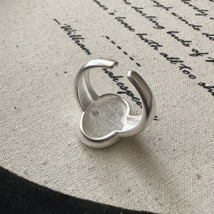 Retro S925 sterling silver adjustable clover ring with a brushed metallic texture finish