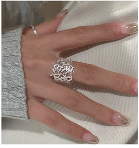 Detail shot of a S925 sterling silver wide ring with irregular bird nest mesh texture