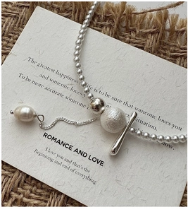 Detail of S925 silver beaded necklace with vintage OT buckle and baroque pearl pendant