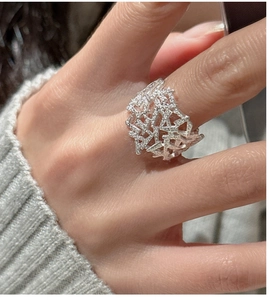 Detailed close-up of S925 sterling silver geometric hollow ring with sparkling zircon stones
