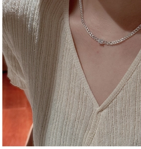 Close-up of S925 sterling silver Cuban link necklace with a sparkling round zircon pendant