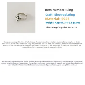 Detail of vintage S925 sterling silver ring with natural speckled stone inlay and plating