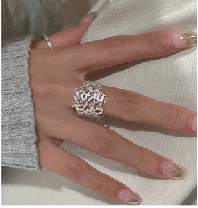 Detail view of a vintage textured silver ring with an irregular hollow geometric pattern