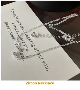 Detailed macro view of S925 sterling silver necklace with AG925 hallmark and single zircon