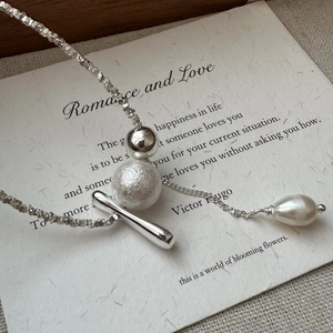 Elegant S925 sterling silver necklace with tassels, metallic beads and a pearl drop