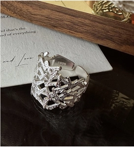 Macro detail of S925 sterling silver ring showing hand-hammered texture and S925 engraving