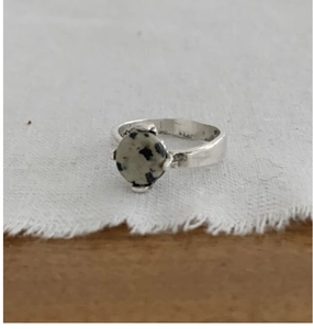 Detailed view of S925 silver ring featuring a round claw-set Dalmatian Jasper gemstone