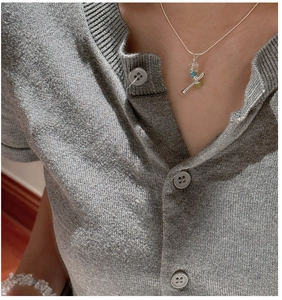 Close-up of S925 sterling silver stacked necklace with colorful crystal pendant on model