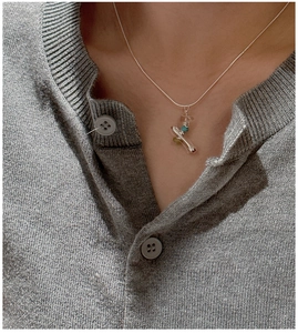 Detailed view of S925 sterling silver necklace with colorful beads on a neck model