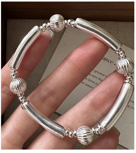 Detail of S925 sterling silver beaded bracelet with textured watermelon beads