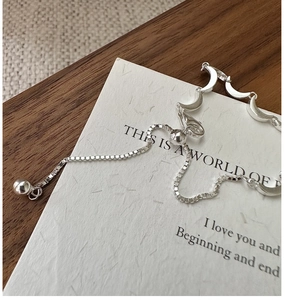 Detail view of S925 sterling silver moon bracelet with adjustable sliding bead closure