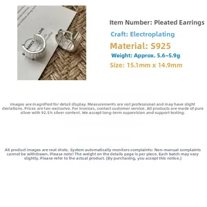 Macro detail of S925 sterling silver hoop earrings with vintage wrinkled texture