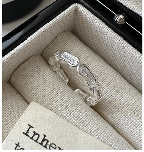 Detailed macro shot of S925 sterling silver chain link ring with pavé zirconia stones
