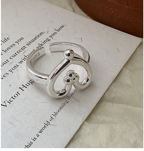 Macro view of S925 sterling silver heart ring showing the engraved hallmark detail