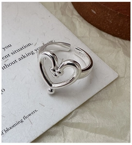 Detailed close-up of S925 sterling silver heart ring showing the S925 hallmark stamp