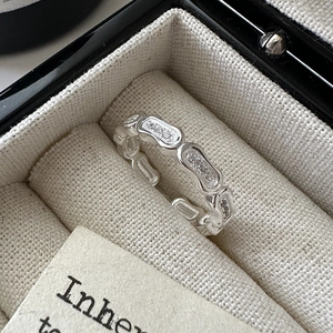 Minimalist S925 sterling silver irregular wave ring featuring sparkling white zircon accents