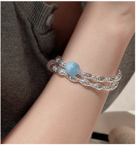 Close-up of double-layer S925 silver beaded bracelet with blue and pink gemstones on wrist