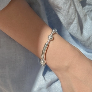 Elegant S925 sterling silver beaded bracelet with smooth tubes and textured melon beads