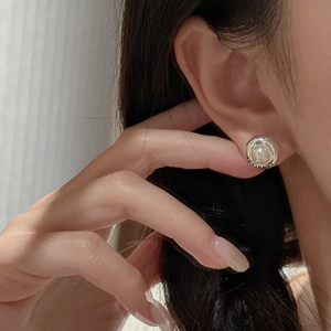 Vintage S925 sterling silver round pearl earrings with engraved edges on female model