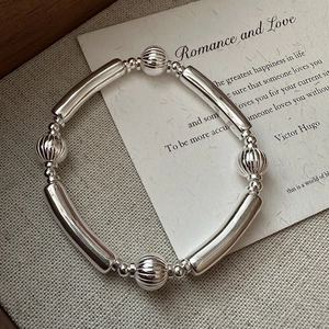 Minimalist S925 sterling silver beaded bracelet with polished tubes and textured spheres