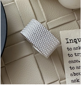 Detailed close-up of S925 sterling silver wide band ring with woven mesh texture design
