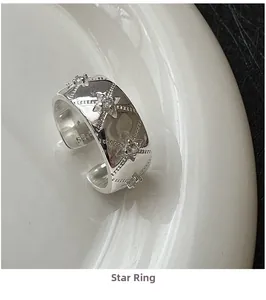 Macro shot of S925 sterling silver ring featuring a detailed North Star relief and small zircon
