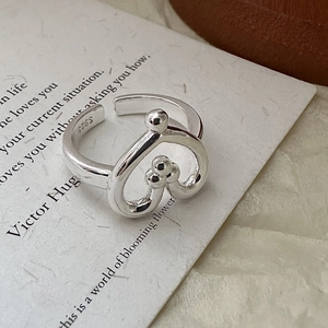 Minimalist S925 sterling silver open heart ring with polished beads on art paper