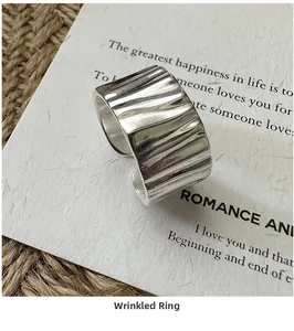 Detail of silver S925 ring featuring vintage wrinkled texture and adjustable open band