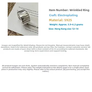 Detail of S925 sterling silver ring featuring minimalist pleated texture and adjustable band