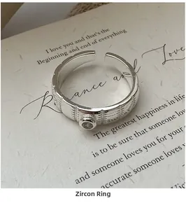 Detailed view of S925 sterling silver ring with zircon stone and textured band