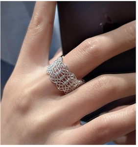 Macro shot of S925 silver lace ring featuring intricate hollow patterns and pave zircon