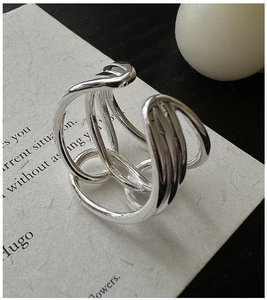 Macro shot of S925 sterling silver ring showing intricate woven hollow design details