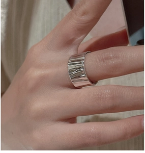 Detailed view of wide S925 sterling silver ring with unique irregular wrinkled texture