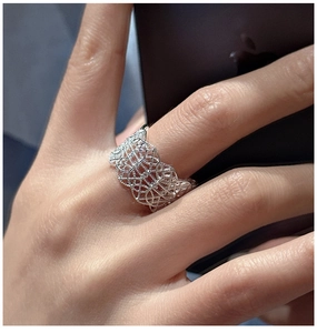 Detailed view of an S925 sterling silver ring with intricate lace texture and micro-inlays