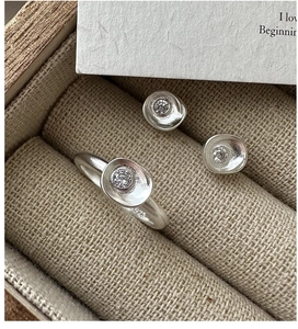 Macro shot of S925 sterling silver jewelry set with matte finish and zircon inlay