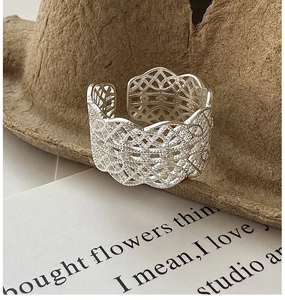 Close-up of S925 sterling silver wide hollow mesh ring with intricate lace texture pattern