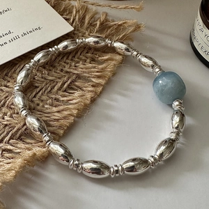 S925 sterling silver beaded bracelet featuring oval silver beads and a light blue stone
