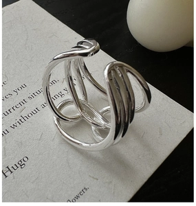 Close-up of S925 sterling silver stamp on minimalist multi-layer interlaced hollow ring