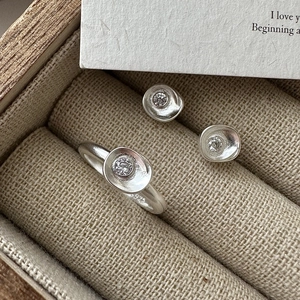 Matte S925 sterling silver jewelry set featuring a ring and earrings with zircon inlay