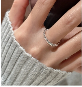 Detail shot of a S925 sterling silver ring featuring a vintage textured surface design