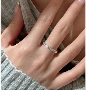 Detail of vintage textured S925 sterling silver ring with engraved floral patterns