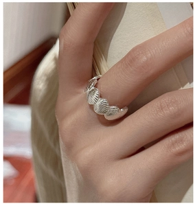 Detail of S925 sterling silver shell design ring showing vintage wavy textured finish