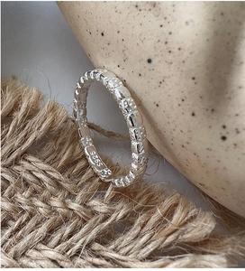 Close-up of S925 sterling silver ring featuring a vintage hammered texture and hallmark