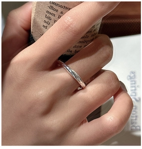 Detailed close-up of S925 sterling silver ring with unique hammered texture on finger