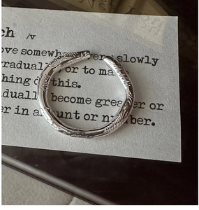 Macro view of adjustable S925 sterling silver ring with organic hand-crafted texture
