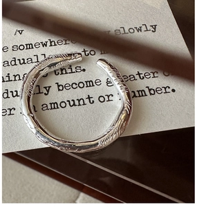 Close-up of S925 sterling silver ring featuring a unique brushed artistic texture