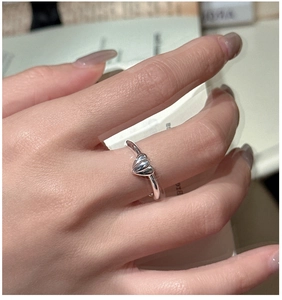 Detailed close-up of S925 sterling silver ring with three stacked heart shapes on hand