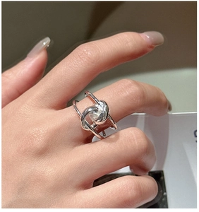 Detailed view of S925 sterling silver ring featuring a modern minimalist knotted design