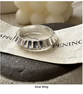 Detailed macro view of S925 sterling silver gear ring with textured industrial design