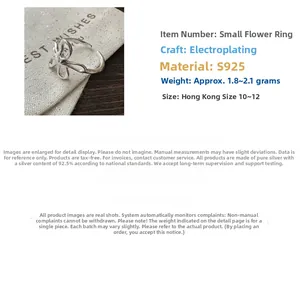 Macro view of S925 sterling silver hollow flower ring with adjustable open design